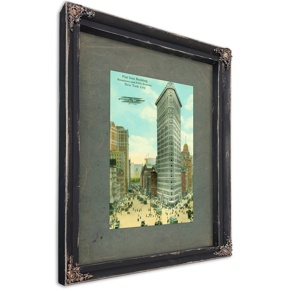 The Iron Sentinel Manhattans Wedge of Progress — Ebony Framed Canvas Print | Bella Frye
