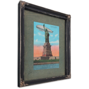 The Colossus and the Silver Leviathan Libertys Vigil at the Golden Door — Ebony Framed Canvas Print | Bella Frye