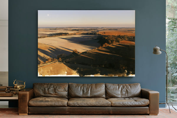 Aerial View Of Sunlit Farmland Fields by Bella Frye