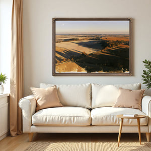 Aerial View Of Sunlit Farmland Fields by Bella Frye
