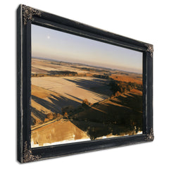 Aerial View Of Sunlit Farmland Fields by Bella Frye
