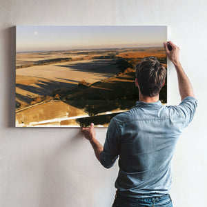 Aerial View Of Sunlit Farmland Fields by Bella Frye
