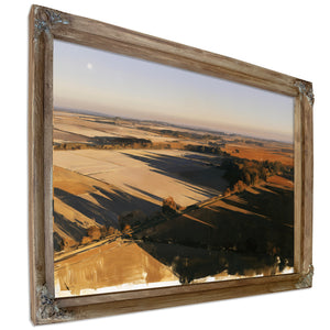 Aerial View Of Sunlit Farmland Fields by Bella Frye