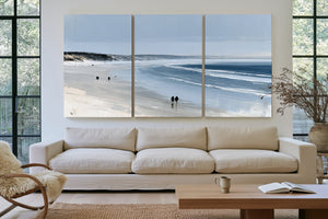 Figures Walking Wide Beach On Overcast Day by Bella Frye