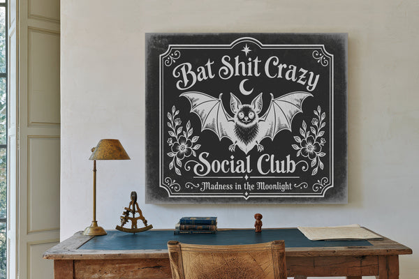 Bat Shit Crazy Social Club Sign Halloween wall art in a styled room