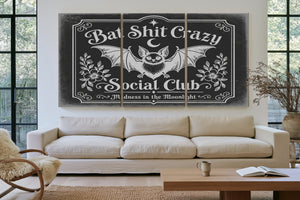 Bat Shit Crazy Social Club Sign Halloween wall art in a styled room