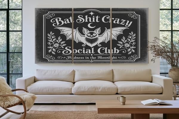 Bat Shit Crazy Social Club Sign Halloween wall art in a styled room