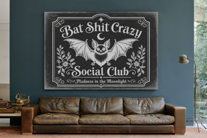 Bat Shit Crazy Social Club Sign Halloween wall art in a styled room