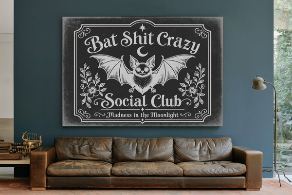 Bat Shit Crazy Social Club Sign Halloween wall art in a styled room
