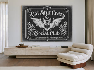 Bat Shit Crazy Social Club Sign Halloween wall art in a styled room