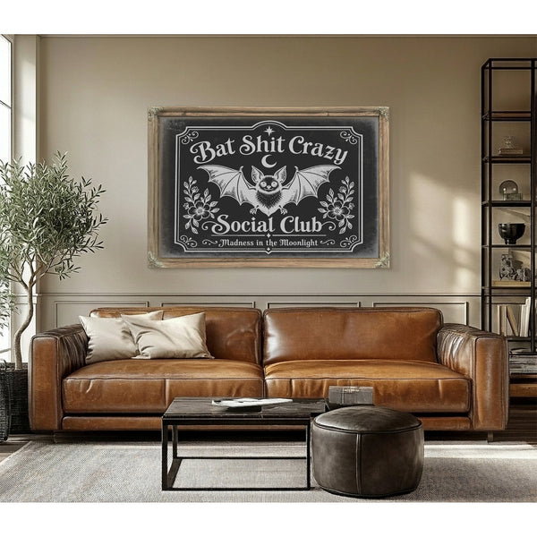 Bat Shit Crazy Social Club Sign Halloween wall art in a styled room