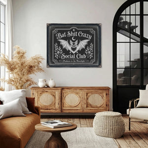 Bat Shit Crazy Social Club Sign Halloween wall art in a styled room