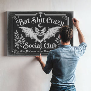 Bat Shit Crazy Social Club Sign Halloween wall art in a styled room