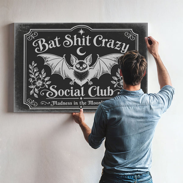 Bat Shit Crazy Social Club Sign Halloween wall art in a styled room