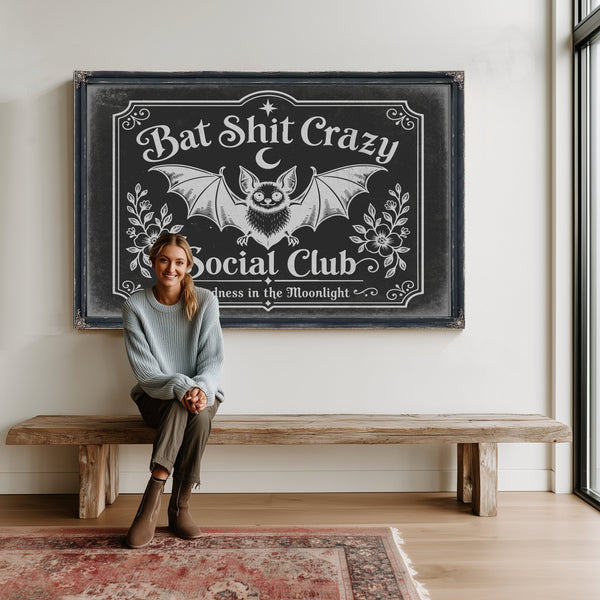 Bat Shit Crazy Social Club Sign Halloween wall art in a styled room