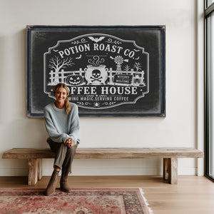 Haunted Coffee House Sign Halloween wall art in a styled room