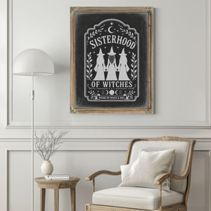 Sisterhood of Witches Sign Halloween wall art in a styled room