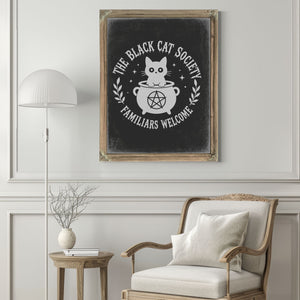 The Black Cat Society Sign Halloween wall art in a styled room