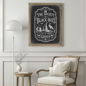 The Society of Black Cats Sign Halloween wall art in a styled room