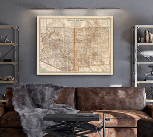 a living room with a couch and a map on the wall