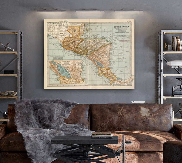 a living room with a couch and a map on the wall