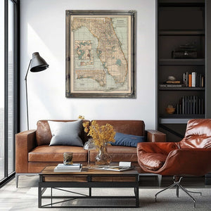 a living room with a couch a chair and a map