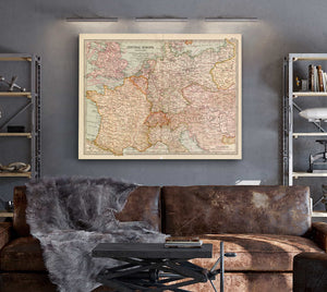 a living room with a couch and a map on the wall