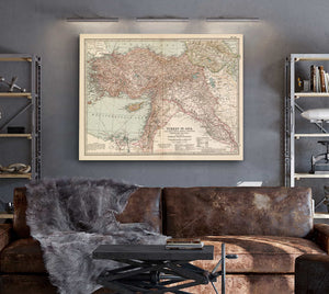 a living room with a couch and a map on the wall