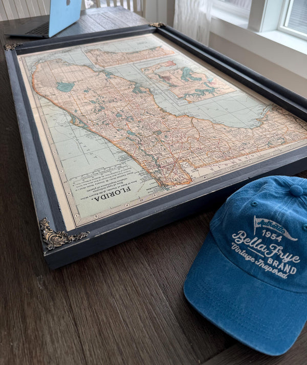 a hat and a map on a table